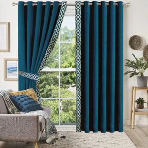 Teal heavy curtains over a window.