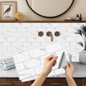 Image of someone adding peel and stick that looks like subway tile.